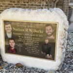 Photo # 18 NATHAN BURKE Photo engraved bronze plaque with full color image, flat band border and oxidized color, Studs on back for mounting.