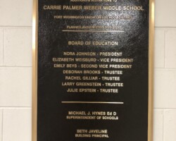 Bronze plaque #2 cast bronze plaque, flat band beveled border, brown background, leatherette texture, concealed stud mounted cinderblock wall.