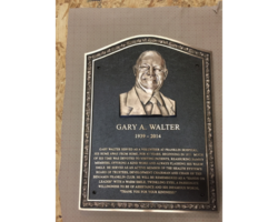 Photo #28 Cast bronze plaque, arched top, Sculpted Ivy leaf border, Bronze bas-relief head.