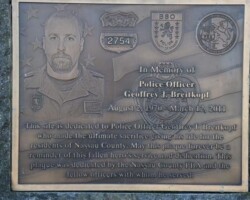 nassau-pba-bronze photo engraved Bronze plaque with a flat band border and oxidized color, Studs on back for mounting.