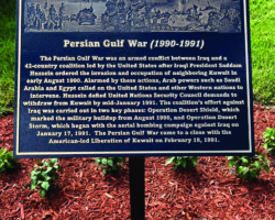 MILITARY PLAQUES & EMBLEMS #44 PHOTO ENGRAVE BRONZE PLAQUE, INSET FLAT BAND BORDER, BROWN BACKGROUND, IMAGES OF THE PERSIAN GULF WAR ON A GARDEN POST